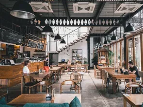 Café interior with pendant lights and timber seating